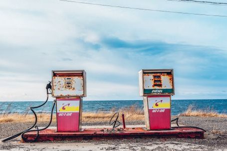 Petroleum - White and Pink Gasoline Station Near Ocean