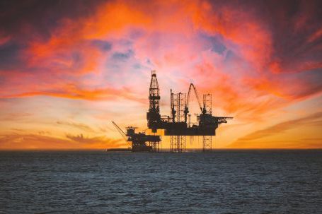 Oil Exploration - Sunset over Oil Platform